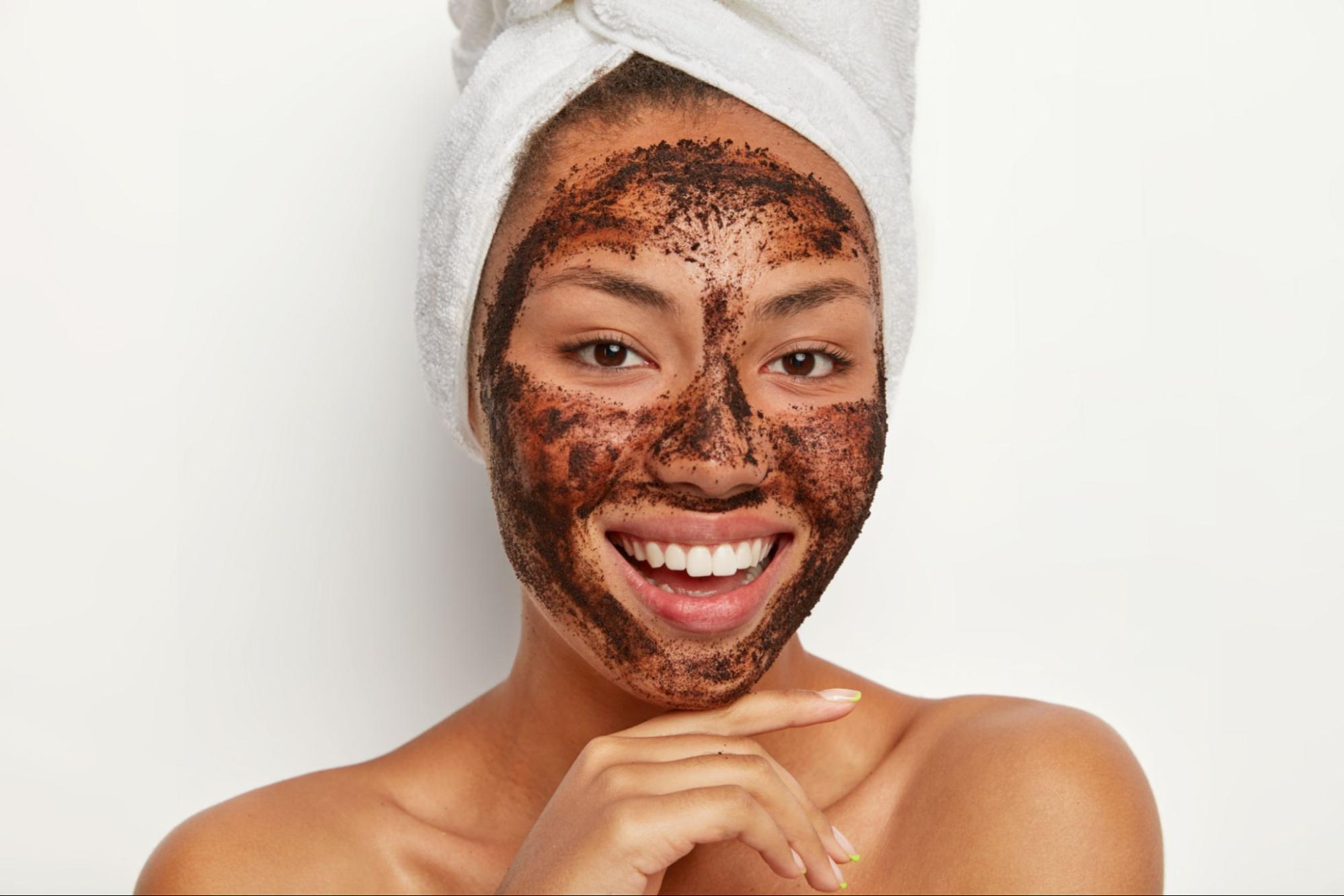 A woman with an exfoliation mask on her face to represent one of the Primary Types of Exfoliation